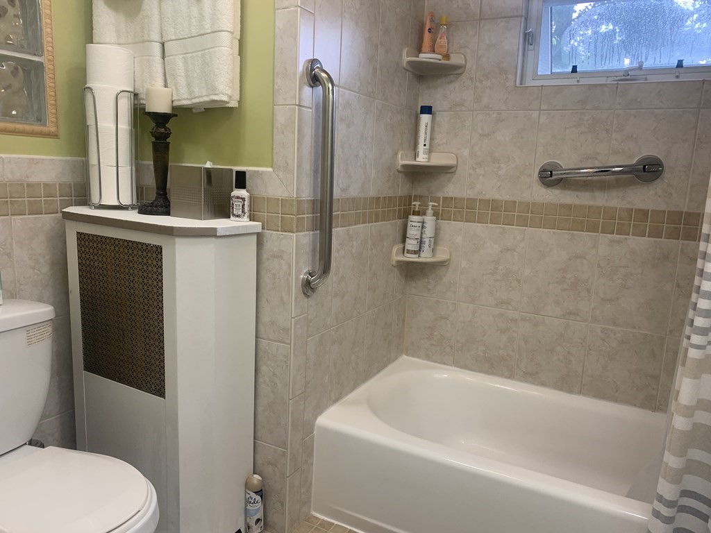 35 5th Street Medford, MA 02155 - Photo 27 of 42 a bathroom with a sink a toilet and shower