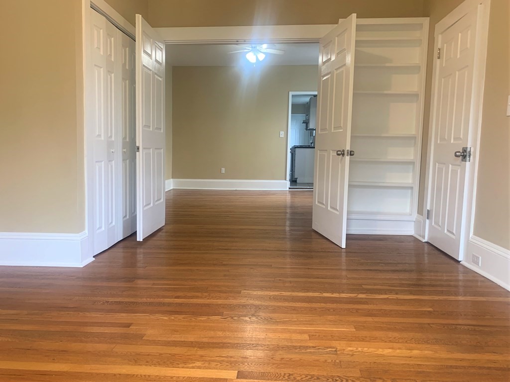 35 5th Street Medford, MA 02155 - Photo 31 of 42 a view of empty room with wooden floor