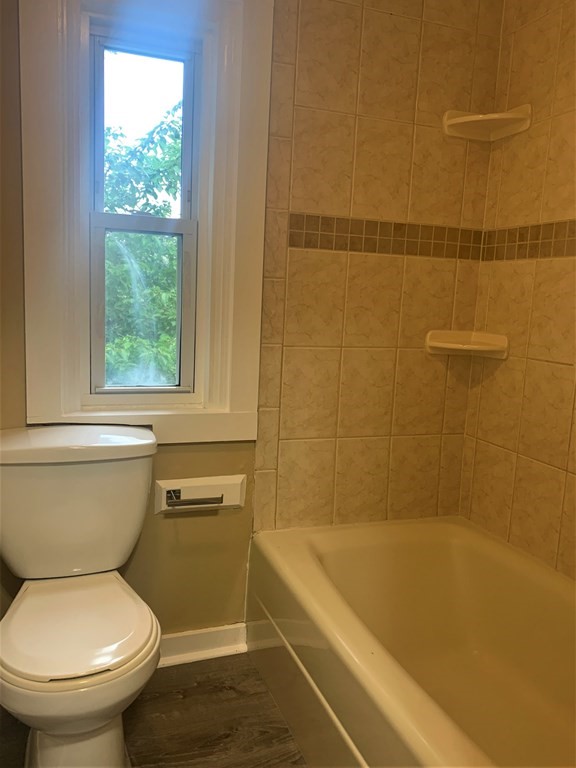 35 5th Street Medford, MA 02155 - Photo 38 of 42 a bathroom with a sink and a toilet