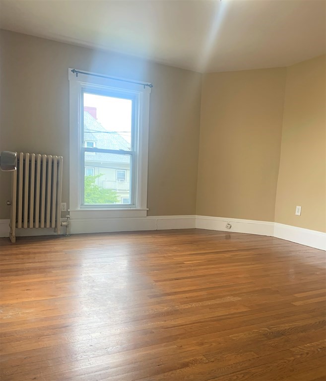 35 5th Street Medford, MA 02155 - Photo 39 of 42 a view of a room with wooden floor and a window