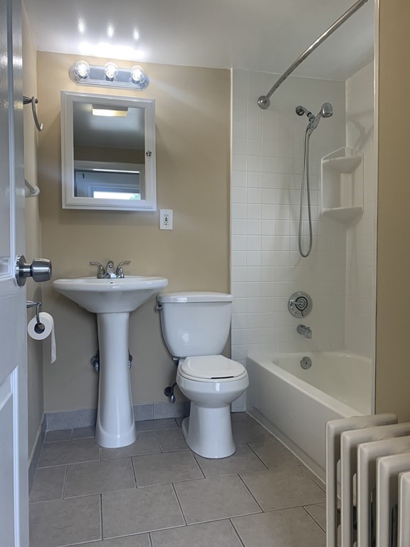 35 5th Street Medford, MA 02155 - Photo 41 of 42 a bathroom with a sink toilet and shower
