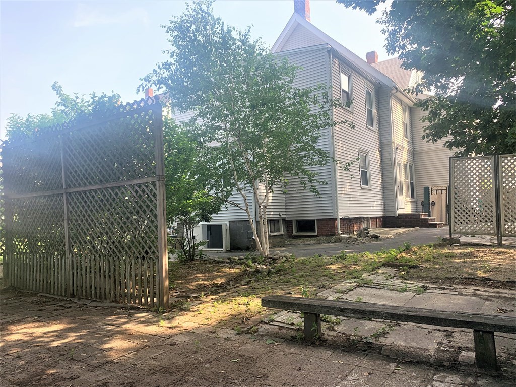 35 5th Street Medford, MA 02155 - Photo 7 of 42 a view of a yard with wooden fence