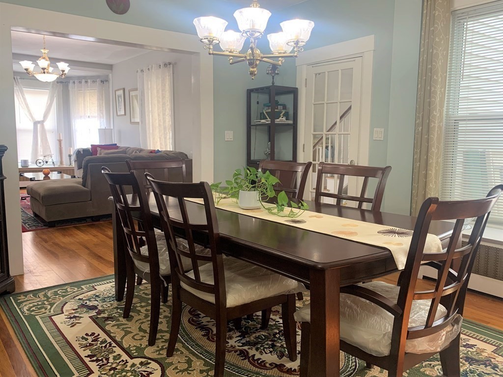 35 5th Street Medford, MA 02155 - Photo 9 of 42 a view of a dining room with furniture and wooden floor