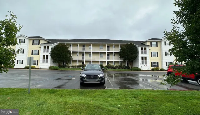 a house view with a sitting space and garden