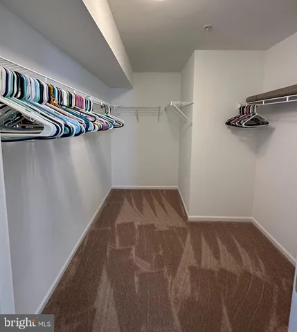 a bathroom with a sink a toilet a mirror and vanity