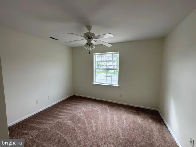 a spacious bathroom with a double vanity sink and a mirror