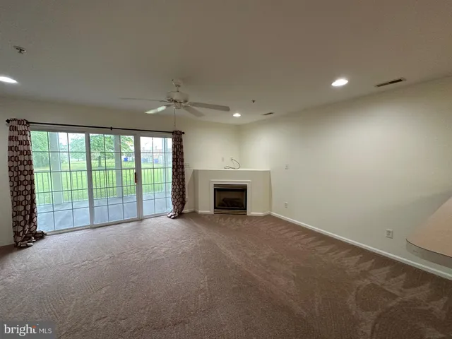 a kitchen with refrigerator and stove