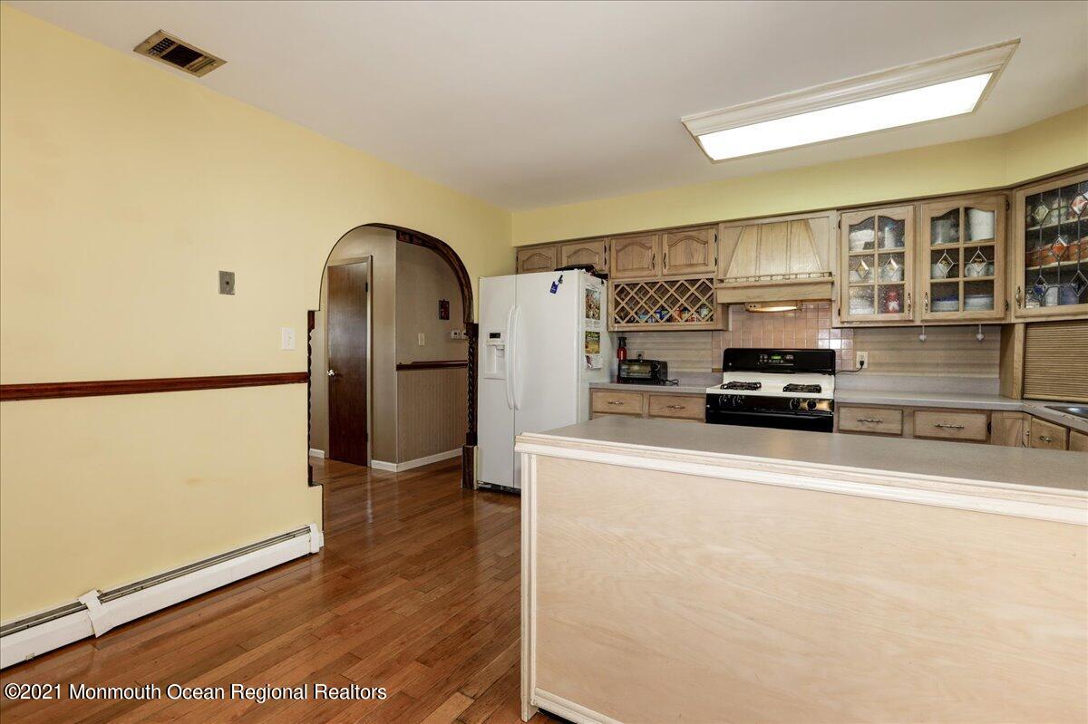 41 Haines Street Lanoka Harbor, NJ 08734 - Photo 18 of 43 a kitchen with stainless steel appliances a refrigerator and a stove