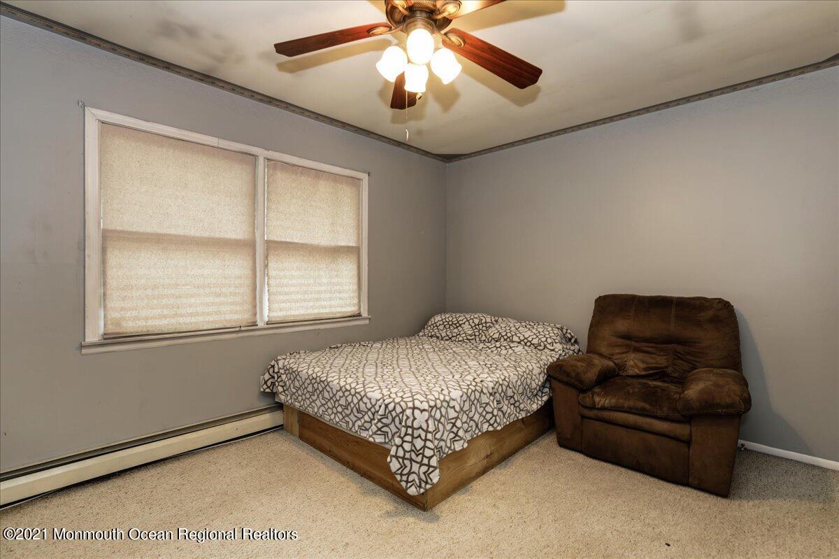 41 Haines Street Lanoka Harbor, NJ 08734 - Photo 23 of 43 a bedroom with a bed and window