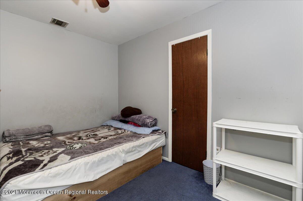 41 Haines Street Lanoka Harbor, NJ 08734 - Photo 25 of 43 a bedroom with a bed and a window