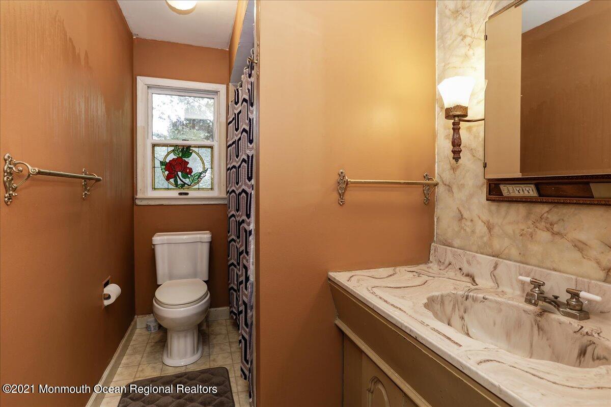41 Haines Street Lanoka Harbor, NJ 08734 - Photo 27 of 43 a bathroom with a sink and a toilet
