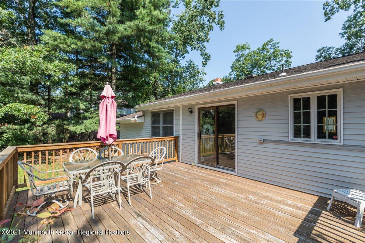 41 Haines Street Lanoka Harbor, NJ 08734 - Photo 32 of 43 a view of a patio with table and chairs and potted plants