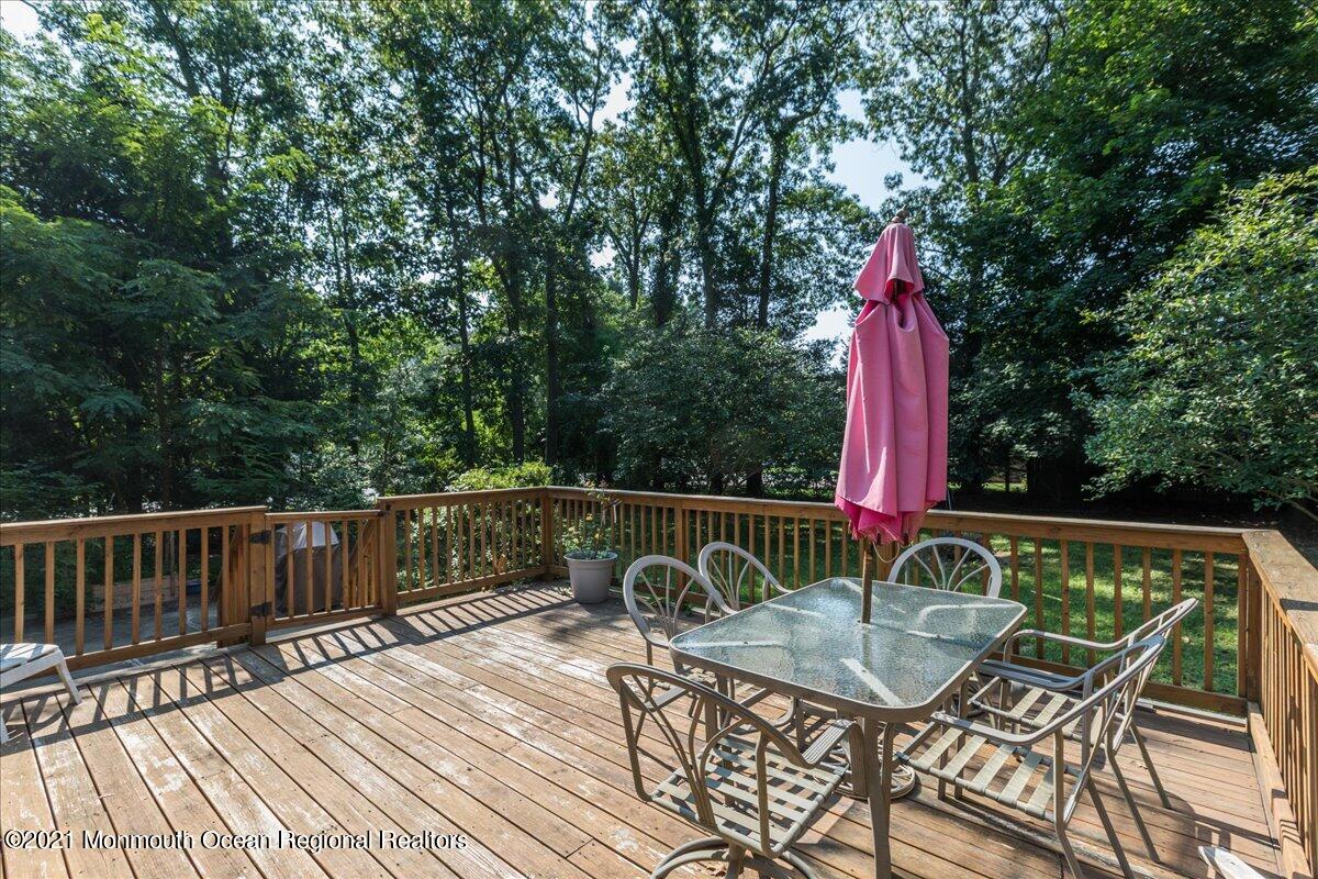 41 Haines Street Lanoka Harbor, NJ 08734 - Photo 33 of 43 a view of a chair and table on the wooden deck