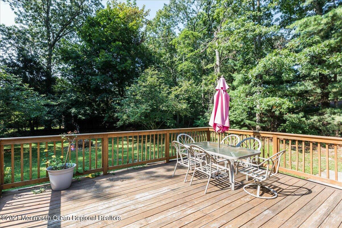 41 Haines Street Lanoka Harbor, NJ 08734 - Photo 34 of 43 a view of balcony with wooden floor and outdoor seating