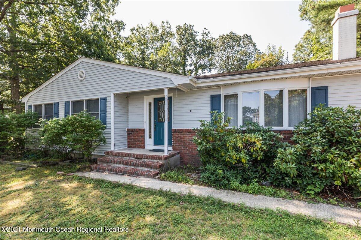 41 Haines Street Lanoka Harbor, NJ 08734 - Photo 5 of 43 a front view of a house with yard and green space