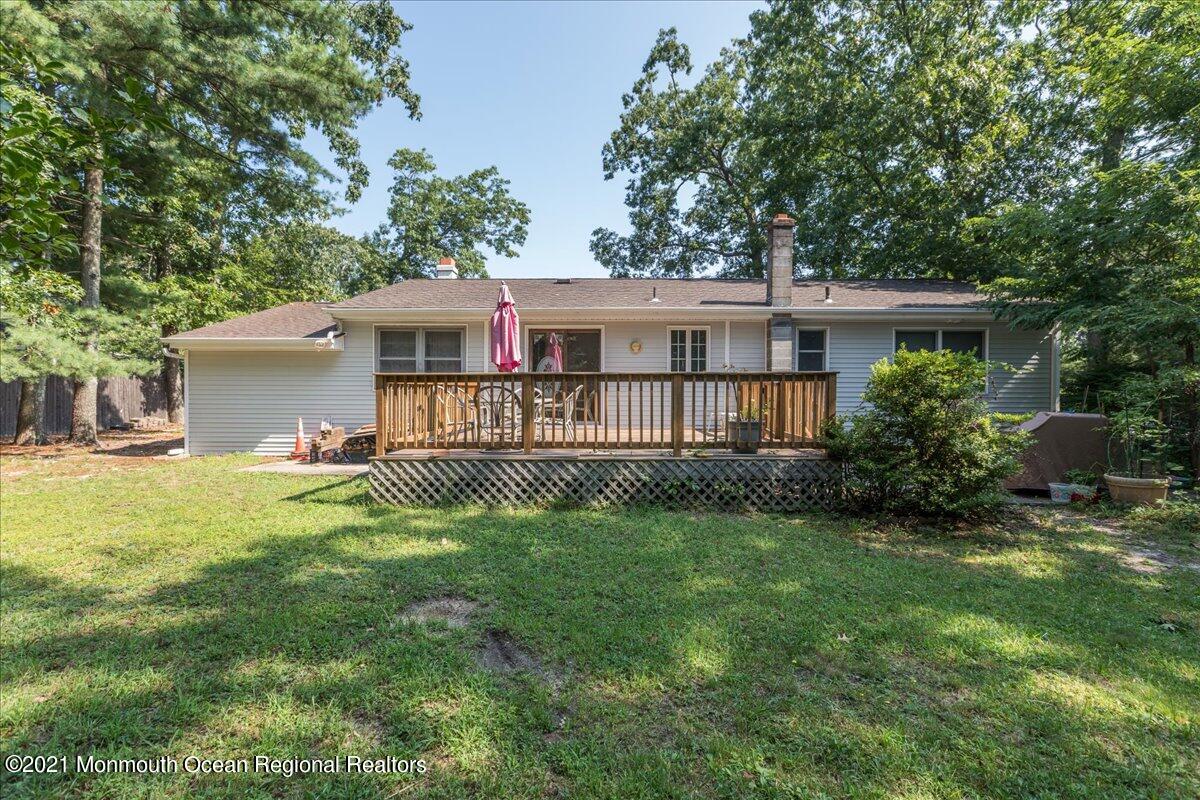 41 Haines Street Lanoka Harbor, NJ 08734 - Photo 42 of 43 a view of a house with a yard and a garden