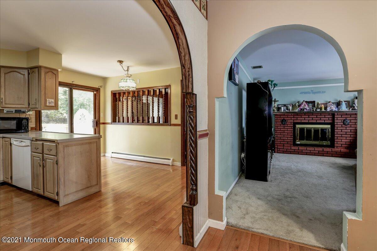 41 Haines Street Lanoka Harbor, NJ 08734 - Photo 10 of 43 a view of a kitchen with furniture and a fireplace