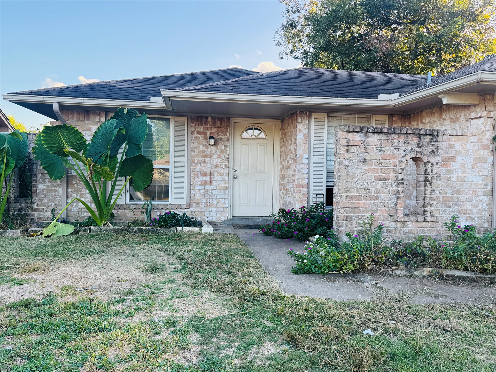 4414 Debeney Drive Houston, TX 77039 - Photo 6 of 6 a front view of a house with garden