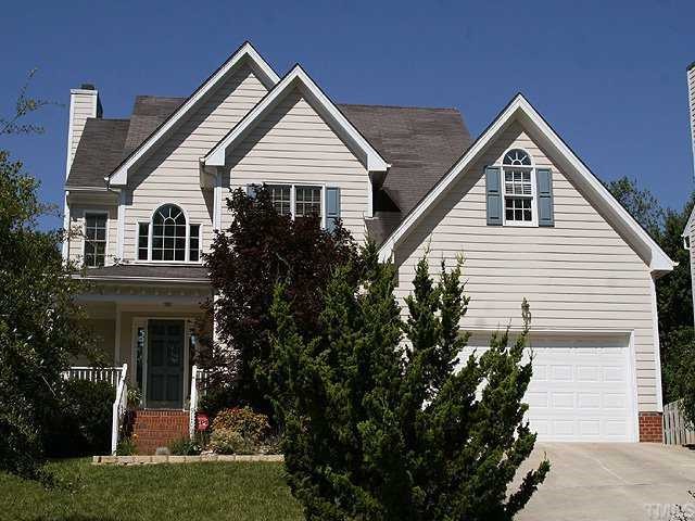 9109 Dawnshire Road Raleigh, NC 27615 - Photo 1 of 12 a front view of a house with a yard