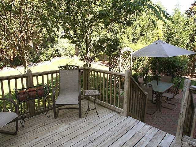 9109 Dawnshire Road Raleigh, NC 27615 - Photo 11 of 12 a view of a chairs and table on the wooden floor