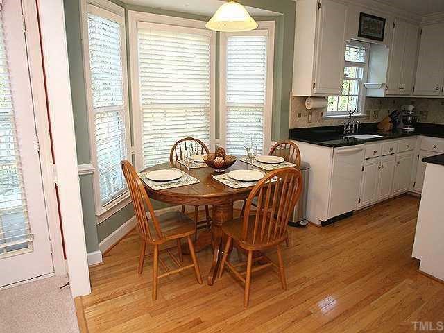 9109 Dawnshire Road Raleigh, NC 27615 - Photo 5 of 12 a dining room with furniture and wooden floor