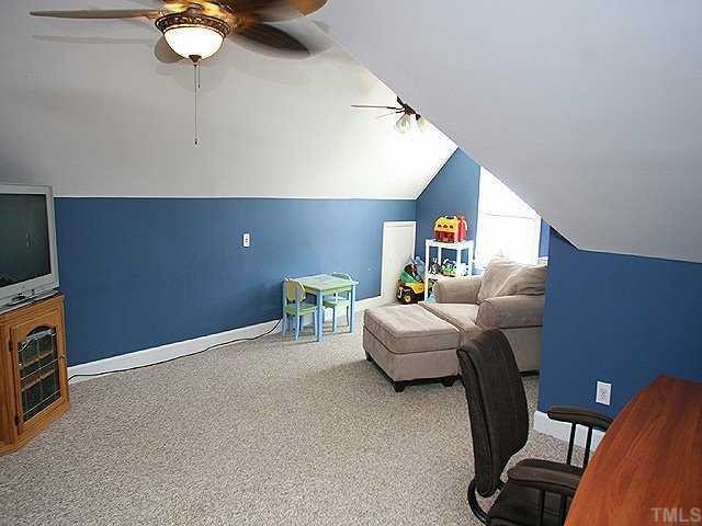 9109 Dawnshire Road Raleigh, NC 27615 - Photo 8 of 12 a living room with furniture