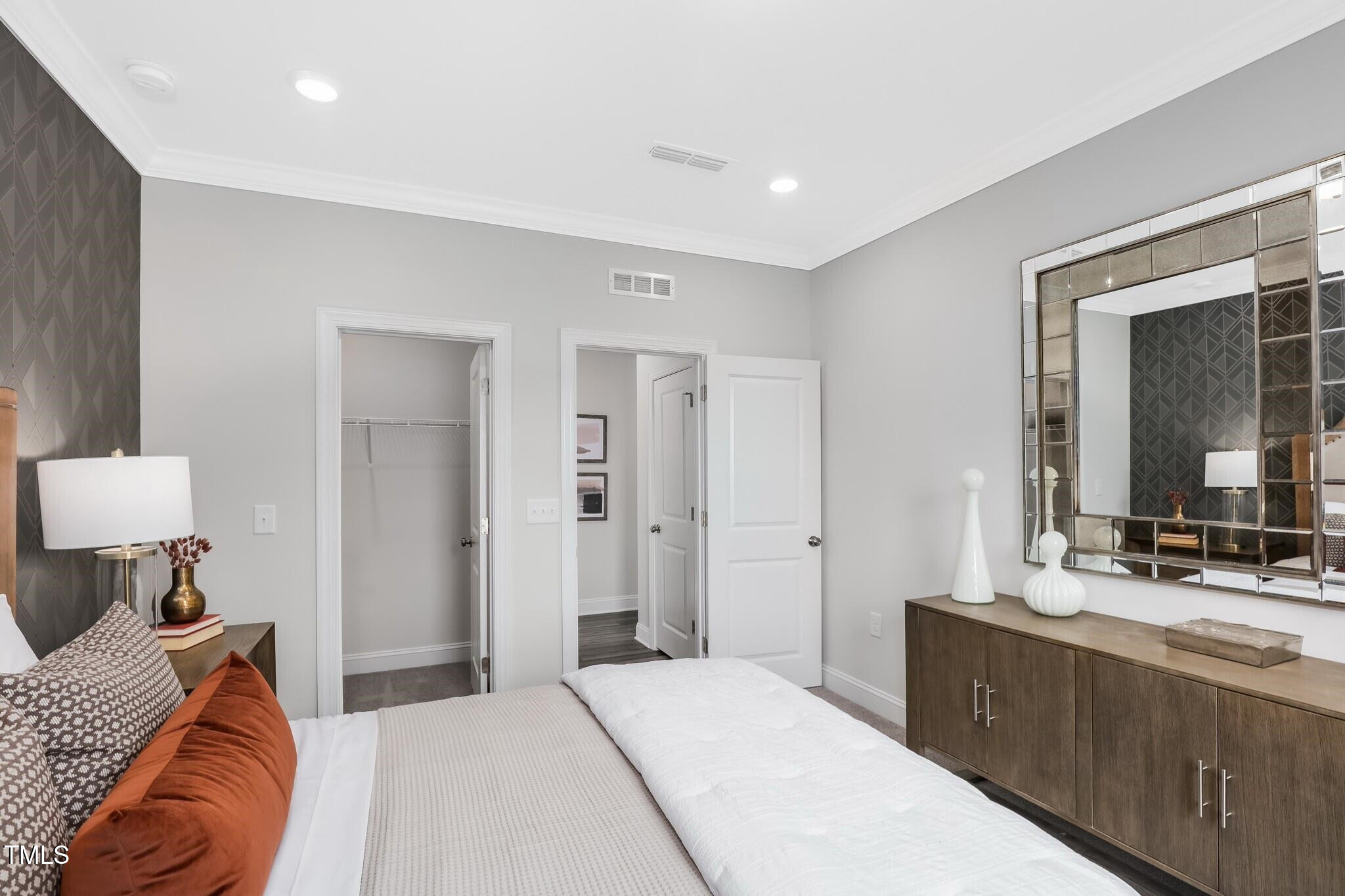 361 Calvander Lane Apex, NC 27539 - Photo 22 of 47 a bedroom with a bed and a dresser