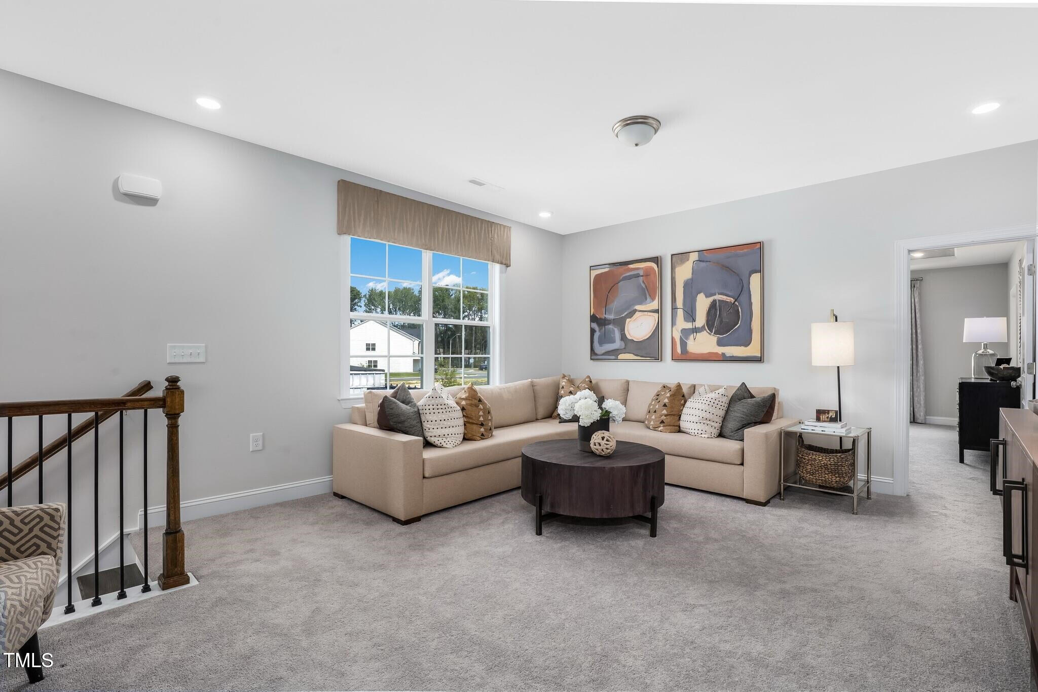 361 Calvander Lane Apex, NC 27539 - Photo 24 of 47 a living room with furniture and a window
