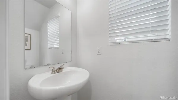 a bathroom with a sink and mirror