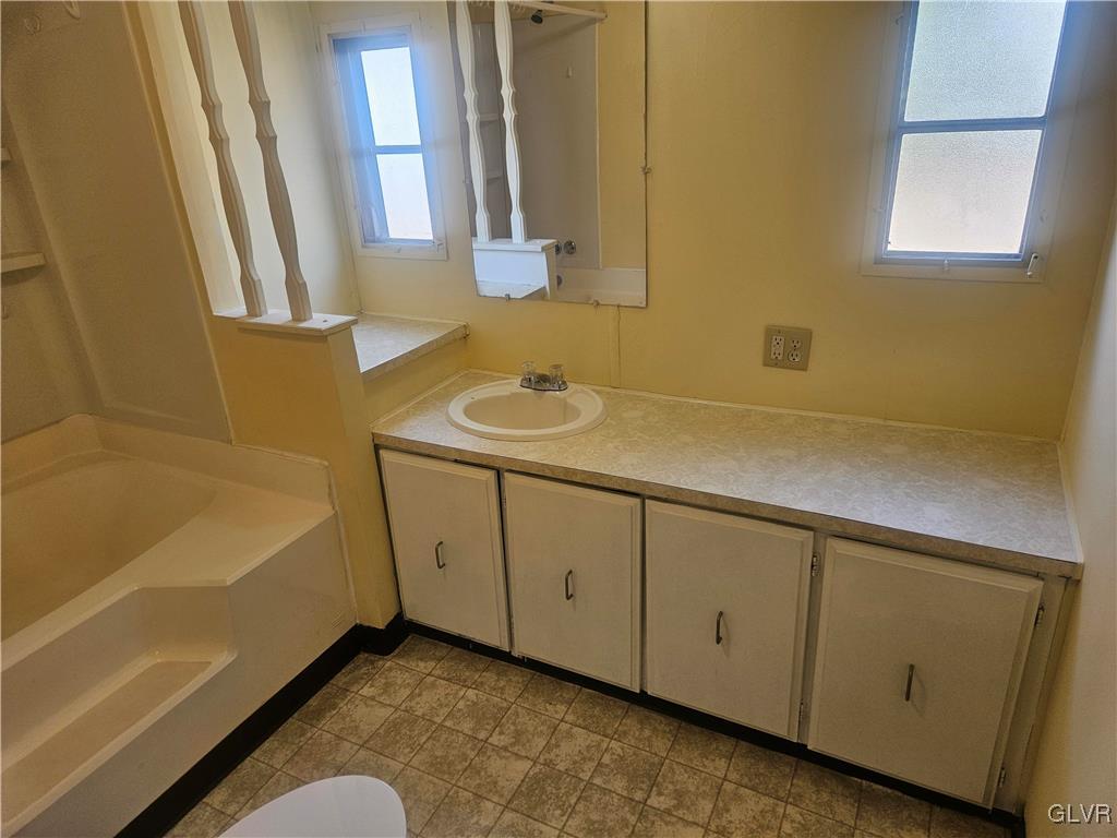 44 Apache Lehighton, PA 18235 - Photo 15 of 18 a bathroom with a tub sink and mirror