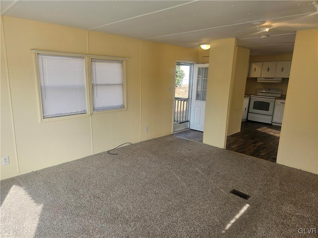 44 Apache Lehighton, PA 18235 - Photo 3 of 18 an empty room with wooden floor and windows