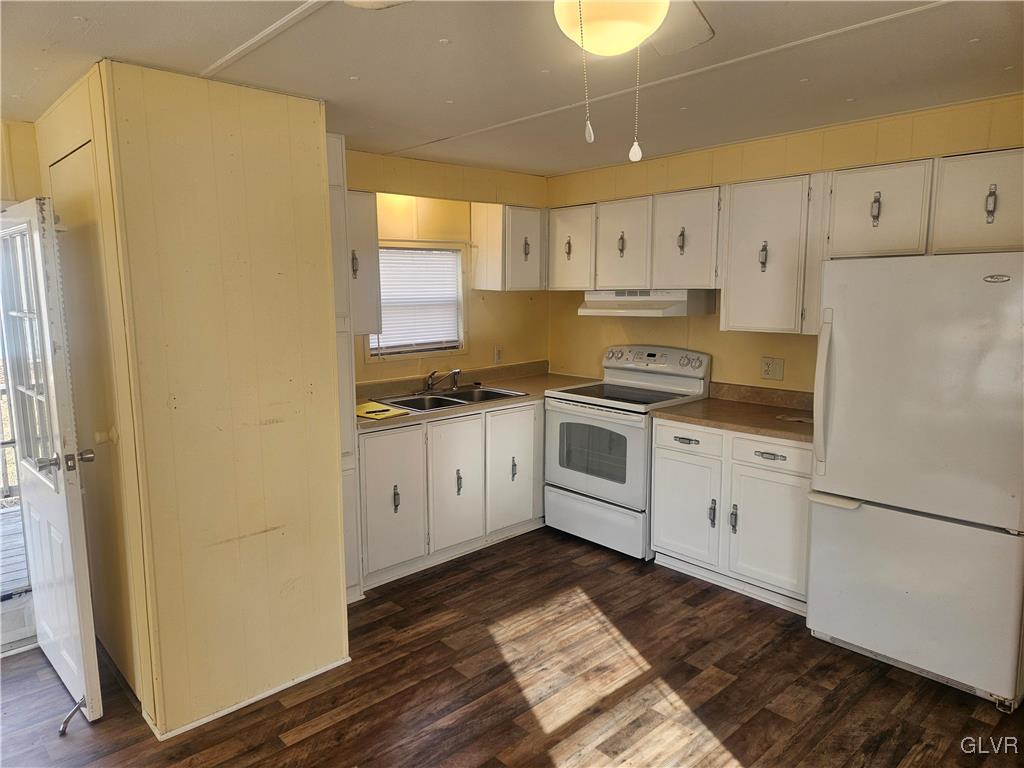 44 Apache Lehighton, PA 18235 - Photo 6 of 18 a kitchen with white cabinets and white appliances