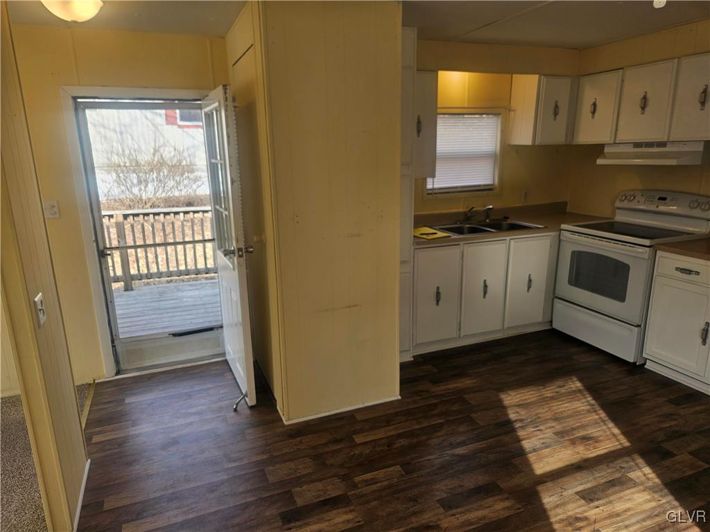 44 Apache Lehighton, PA 18235 - Photo 8 of 18 a kitchen with granite countertop wooden floors and white stainless steel appliances