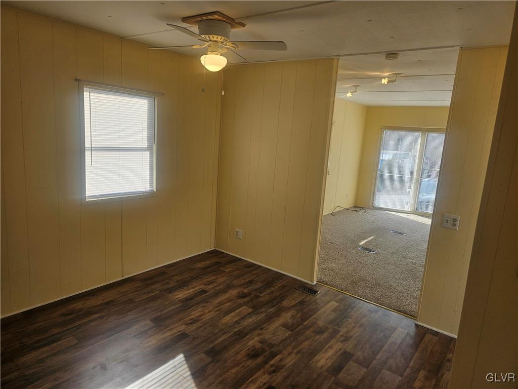 44 Apache Lehighton, PA 18235 - Photo 9 of 18 an empty room with wooden floor and windows