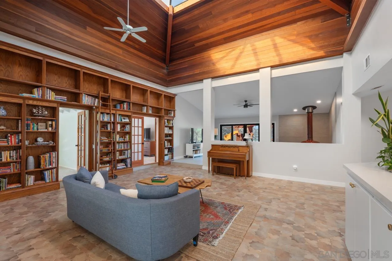 11869 Hi Ridge Road Lakeside, CA 92040 - Photo 16 of 73 a living room with furniture and a flat screen tv