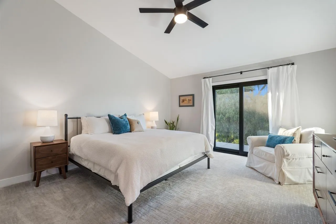 11869 Hi Ridge Road Lakeside, CA 92040 - Photo 38 of 73 a bedroom with a bed and large window