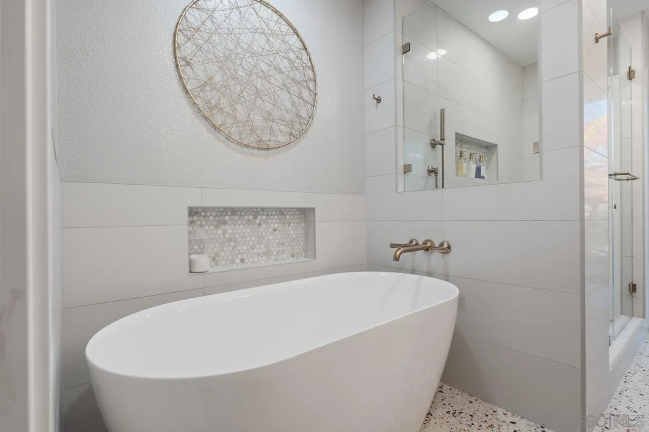 11869 Hi Ridge Road Lakeside, CA 92040 - Photo 42 of 73 a bathroom with a bathtub and a shower