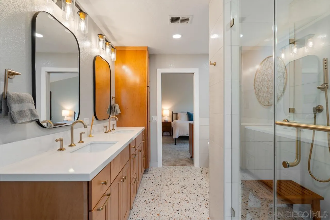 11869 Hi Ridge Road Lakeside, CA 92040 - Photo 44 of 73 a bathroom with a double vanity sink mirror and shower
