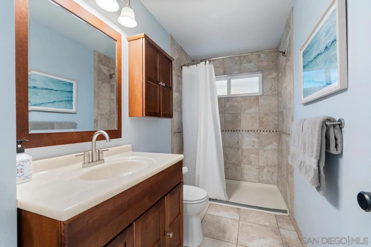 11869 Hi Ridge Road Lakeside, CA 92040 - Photo 53 of 73 a bathroom with a sink mirror shower and toilet