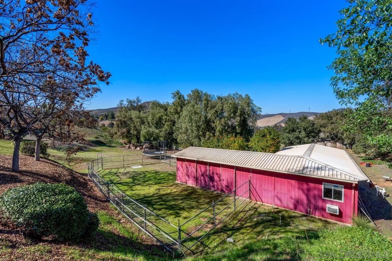 11869 Hi Ridge Road Lakeside, CA 92040 - Photo 69 of 73 a view of a big yard with red brick house in the background