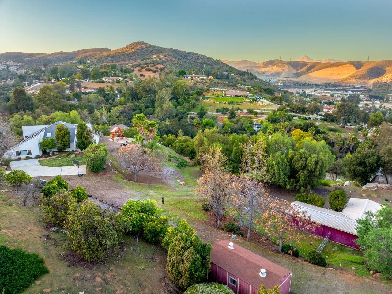 11869 Hi Ridge Road Lakeside, CA 92040 - Photo 7 of 73 an aerial view of green landscape with trees houses and mountain view