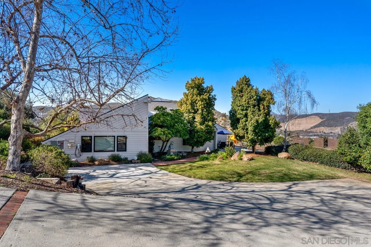 11869 Hi Ridge Road Lakeside, CA 92040 - Photo 8 of 73 a front view of a house with a yard