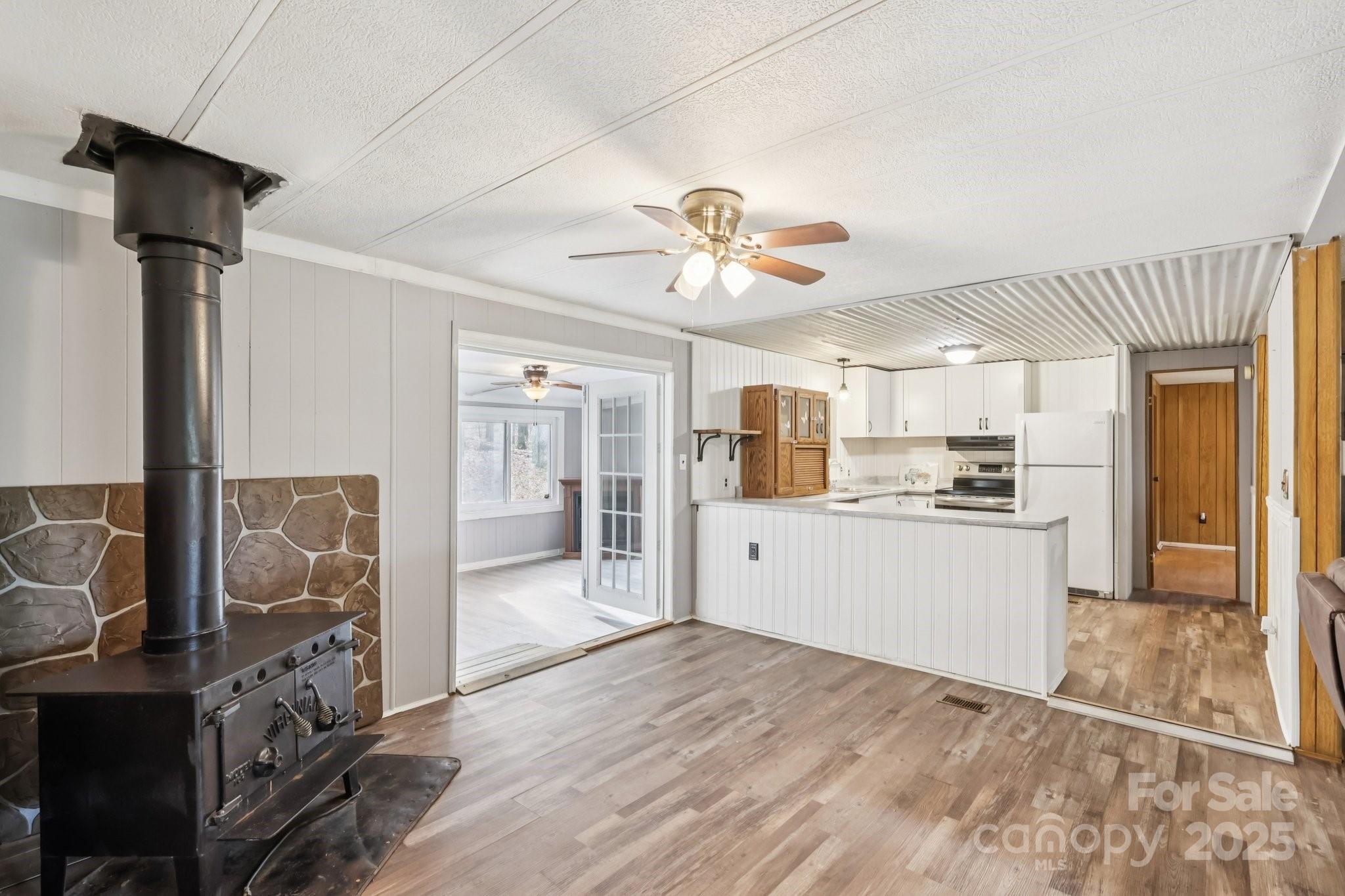 920 Dewitt Helms Road Monroe, NC 28112 - Photo 12 of 47 a view of a kitchen with a sink and refrigerator
