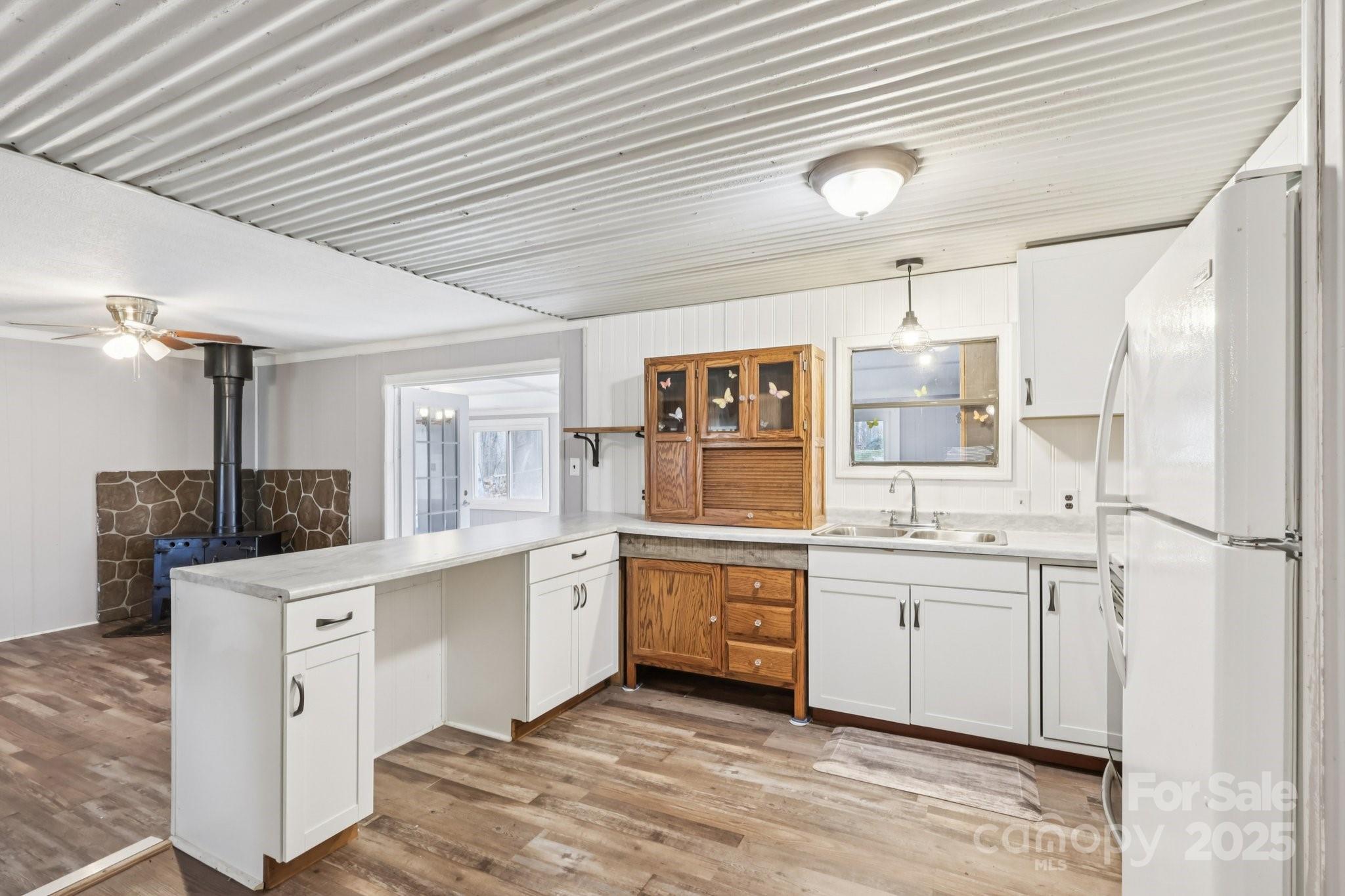 920 Dewitt Helms Road Monroe, NC 28112 - Photo 13 of 47 a kitchen with white cabinets appliances and sink