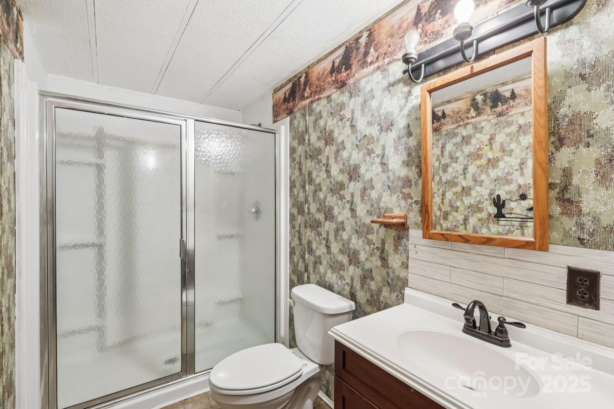 920 Dewitt Helms Road Monroe, NC 28112 - Photo 19 of 47 a bathroom with a sink toilet and shower