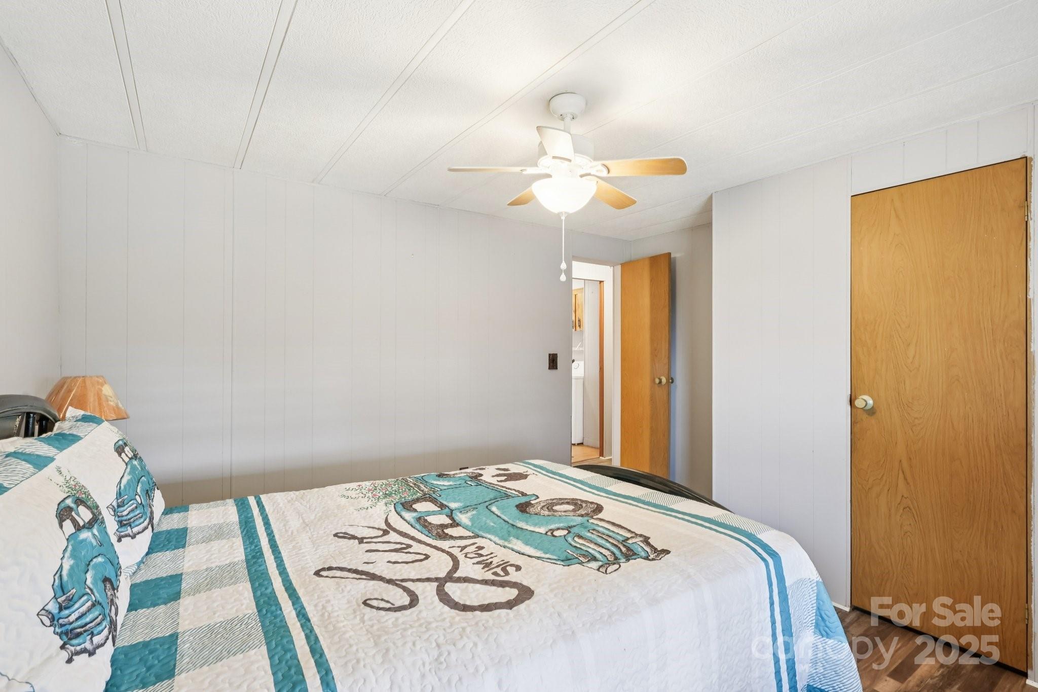 920 Dewitt Helms Road Monroe, NC 28112 - Photo 23 of 47 a bedroom that has a bed and a chandelier