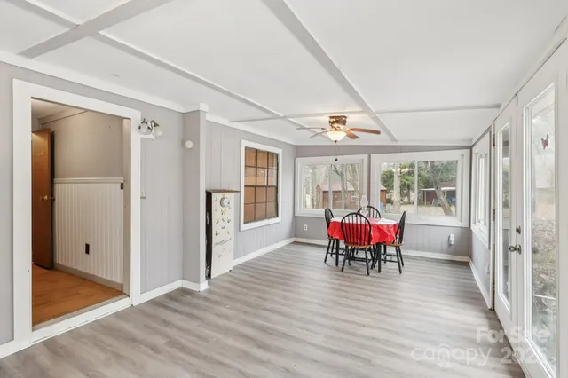 a view of a dining room with furniture and window