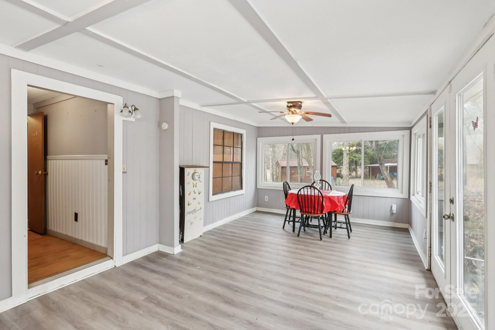 920 Dewitt Helms Road Monroe, NC 28112 - Photo 26 of 47 a view of a dining room with hardwood floor and a chandelier