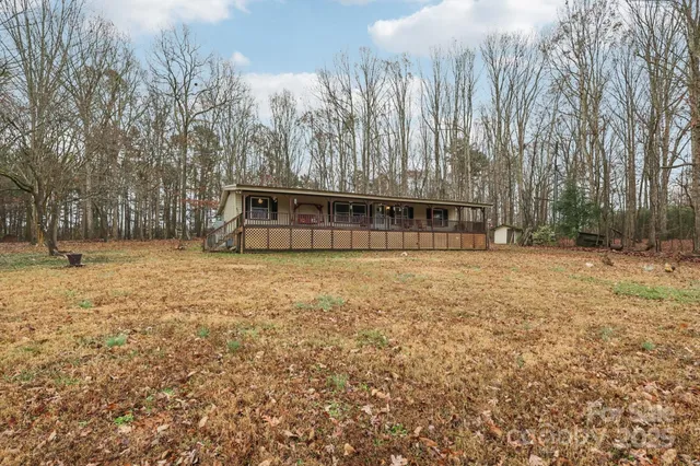 a view of swimming pool with trees in the background