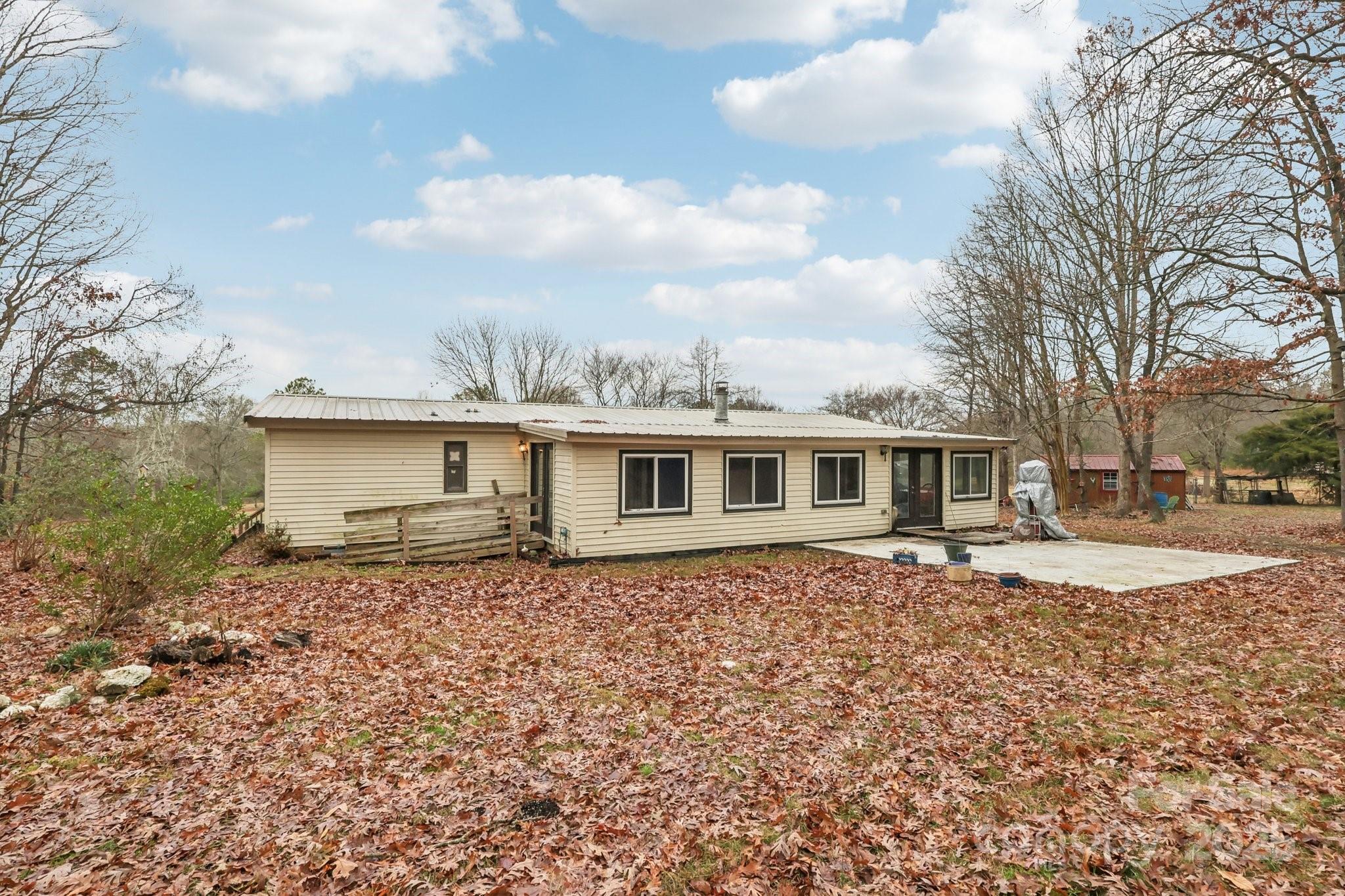 920 Dewitt Helms Road Monroe, NC 28112 - Photo 35 of 47 a house that has a lot of windows in it